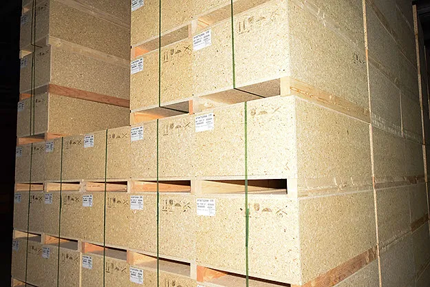 Stacked wooden crates built from squared timber and board material.